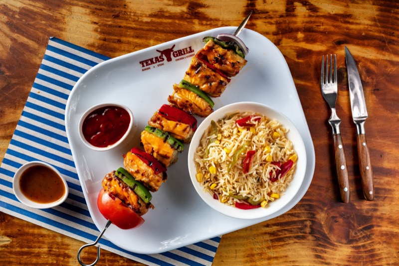 Chicken espetada skewer with rice