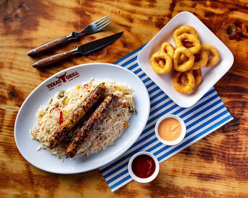 Kofta kebabs with rice and onion rings
