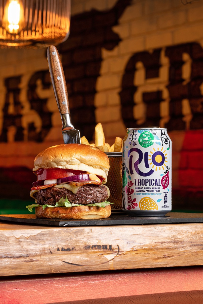 Burger with knife and fries in restaurant