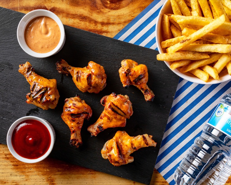 Peri peri wings with fries and sauces